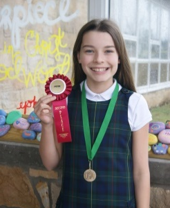 Sixth Grader Abby Urban Places at Diocesan Forensics